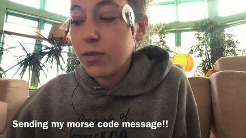 GIF of Dashiell Bark-Huss with texting a morse code message with her eyes.